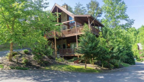 Campfire Dreams, where cozy moments and mountain memories await! Pigeon Forge